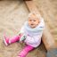 a child sitting in the sandpit