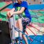 Boy climbing playground Hidden corner steel structure colored webbing.