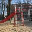 Steel playground structure with red slide - Whale AZTEC.