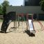 Playground structure Whale - AZTEC steel structure with climbing wall and slide.