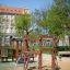 Sherwood wooden playhouse in a playground.