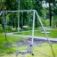 Silver Double Swing in a park with lush green surroundings