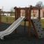 Wooden playground set with slide and climbing wall - Yosemite.