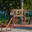 Wooden playground structure with climbing wall and slide - Yosemite.