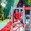 Child playing on Whale steel structure playground.