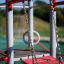 Spider steel structure playground equipment with red and grey design.