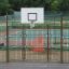 Outdoor basketball hoop with metal safety fence - Tiger playground equipment.