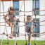 children climbing rope ladders