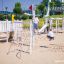 children playing on the white wooden playground ship