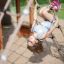 a girl playing on a rope ladder