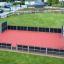 Highbury multifunctional sports court with goals and fencing in a green park area.