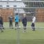 Boys playing football  on the sports arena with  Goal 11570.