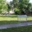 Metal soccer goal on a green field.