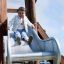Child sliding down a Bergila playground slide.