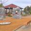 Bench, Steel Construction in Children's Playground with Climbing Rocks