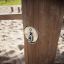 Wooden post of the Kentucky playground equipment in a sandbox.