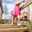 Child playing on Dolomiti wooden playground equipment.