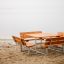 Table & Bench Quadro set on a sandy beach by the lake.