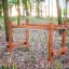 Wooden climbing frame Kongo for children in a forest playground.