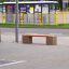 Vega bench at a bus stop in an urban environment