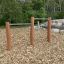Double Somersault Nature - outdoor gymnastic bars made from wood and metal, set in a natural playgro