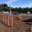 Outdoor wooden play structure Triple Somersault Nature in a playground.