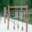 Lianes wooden playground climbing and balancing equipment with suspended wooden blocks.