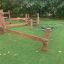 Outdoor playground structure Sahara made of wooden beams and netting.