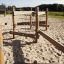 Sahara outdoor wooden playground structure on sandy surface