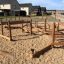 Wooden playground obstacle course for kids named Sahara in a modern housing estate.