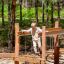 Sahara wooden playground balance bridge with chains in forest setting