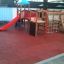 Rubber Tiles 45 installation on playground flooring with wooden play structure and slide