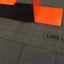 Rubber Tiles 90 by Lars Laj under orange structure.
