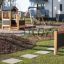 a black wooden playhouse in the residential area