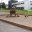 Playhouse Nature wooden play structure in a sandpit on a modern playground.