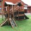 playground set with towers and a slide