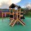 Tower Nature wooden playhouse with slide in playground