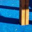 Fortress Nature playhouse on blue playground surface
