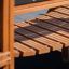 Wooden steps of the Fortress Nature playhouse with slide.