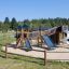 Mastodon castle with slide in a playground setting