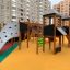 Mastodon castle with slide in a modern playground