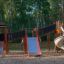 Playground equipment Mastodon castle with slide in a park.
