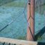 Hammock attachment to wooden post with chain and rope