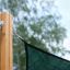 Sun Shade Square Pioneer (Larchwood) attached to a wooden post.