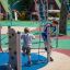 Children playing on the Wonderland Trim Trail playground structure.