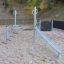 Wonderland Trim Trail obstacle course on a playground surrounded by trees in autumn.