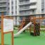 Playground equipment set called Rules Tab with slide, climbing net, and swing.