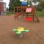 a clover-shaped spring rocker on the public playground