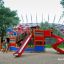 Colorful playground structure Bounty ship with slide in a park.