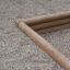Wooden Triangle Sandbox with gravel filling.
